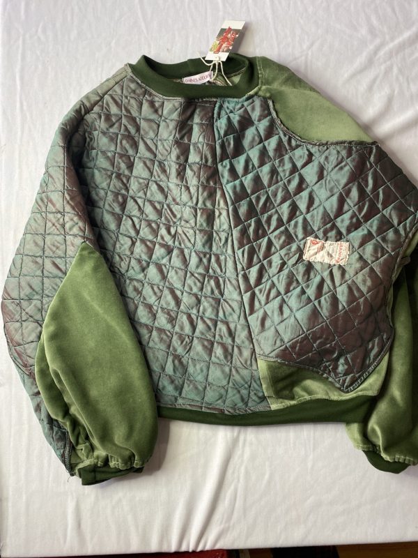 Front flat of green batwing jumper with velvet panels and quilted silk panels from a vintage jacket still featuring it's original labelling