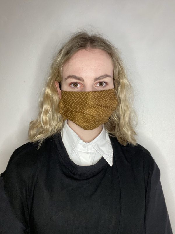 Handmade breathable facemask with filter pocket and adjustable elastic made from vintage remnant materials in Golden brown