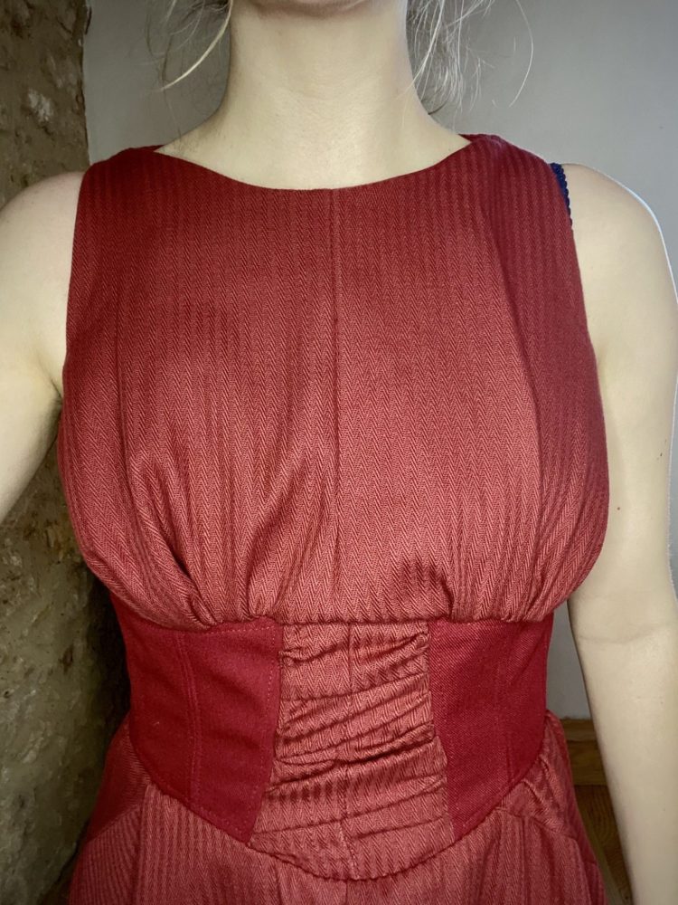 Burgundy 50s style dress in circle skirt in wool and jacquard wool and half corset.