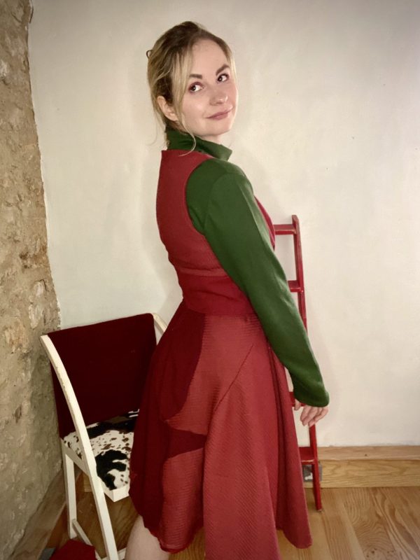 Green sweatshirt oversized turtleneck made dead stock vintage fabric. With burgundy 50s style day dress with full circle skirt and half corset.