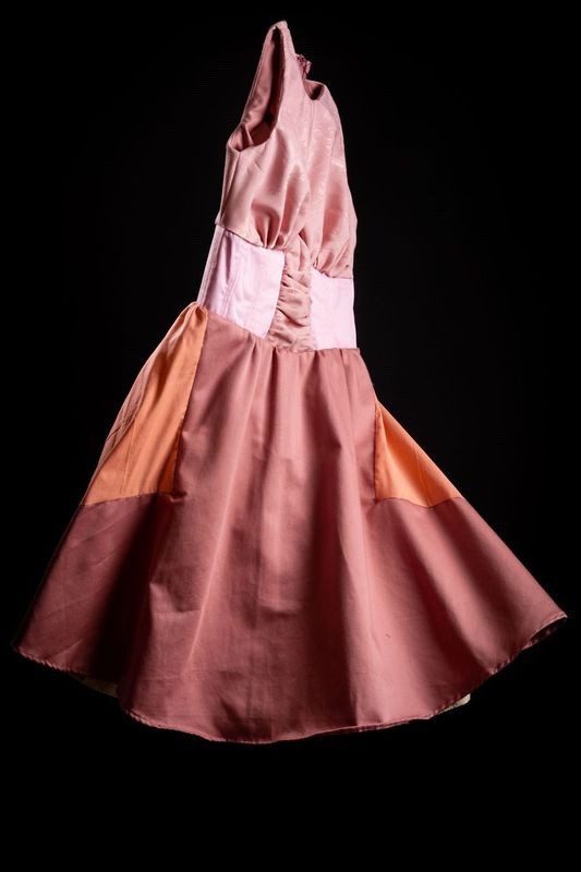 Photography by Yousef Al Nasser of pink zero waste dress with circle skirt and half corset. Made from silk and cotton one of a kind 50s style day dress.