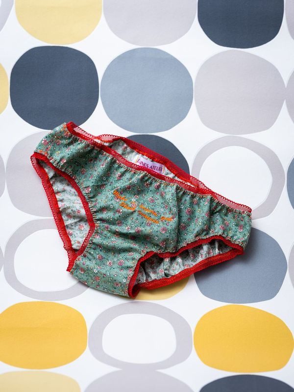 Image of green floral and red knicker elastic. Body positivity panties