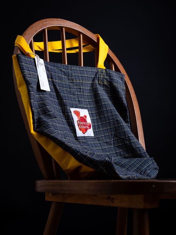 Tote bag in tartan and yellow with Daines atelier branding made from deadstock materials